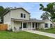 Charming two-story home boasts a well-maintained lawn, inviting entryway, and appealing architectural details at 1305 Willow Valley Dr, Brandon, FL 33510