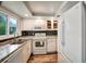 Well-lit kitchen with ample counter space, white cabinets, and modern appliances at 1305 Willow Valley Dr, Brandon, FL 33510