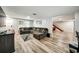 Relaxing living room boasts stylish flooring, a large sofa, and an open staircase at 1305 Willow Valley Dr, Brandon, FL 33510