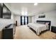 Large main bedroom features plush carpeting, ample natural light, and an entertainment center at 1305 Willow Valley Dr, Brandon, FL 33510