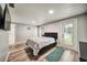 Spacious main bedroom with wood floors, and access to the pool at 1305 Willow Valley Dr, Brandon, FL 33510