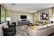 Inviting living room with stylish decor, soft lighting, and a warm, welcoming ambiance at 13050 Wellspring Dr, Lithia, FL 33547