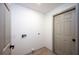 Empty laundry room with connections and door at 13203 Royal George Ave, Odessa, FL 33556