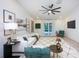Bright living room featuring modern decor, cozy seating, and seamless access to the outdoor area at 13203 Royal George Ave, Odessa, FL 33556