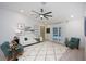 Inviting living room with vaulted ceilings, stylish furnishings, and sliding glass doors to the pool at 13203 Royal George Ave, Odessa, FL 33556