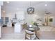 Open-concept living space featuring a modern kitchen, dining area, and comfortable living room at 13203 Royal George Ave, Odessa, FL 33556