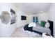 Serene primary bedroom with modern decor, light wood floors, and sliding door access to the outdoors at 13203 Royal George Ave, Odessa, FL 33556
