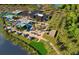 Aerial view of community amenities including swimming pools, tennis courts, clubhouse, and lush landscaping at 13644 Canyon Ridge Rd, Spring Hill, FL 34610