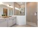 Spa-like bathroom with double vanity, large tiled shower, and contemporary fixtures at 13644 Canyon Ridge Rd, Spring Hill, FL 34610