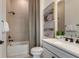 Elegant bathroom featuring a tiled shower and tub, marble countertop, and neutral color palette at 13644 Canyon Ridge Rd, Spring Hill, FL 34610