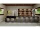 Interior view of Cotee River Tavern, featuring a stylish bar area, seating, and decorative lighting at 13644 Canyon Ridge Rd, Spring Hill, FL 34610