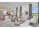 Bright living space open to kitchen featuring modern decor, comfortable seating, and scenic views at 13644 Canyon Ridge Rd, Spring Hill, FL 34610