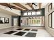 Bright yoga studio with ample natural light, mirrored walls, and exercise mats for a serene workout environment at 13644 Canyon Ridge Rd, Spring Hill, FL 34610