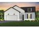 Charming single-Gathering home showcasing a modern farmhouse design with a two-car garage at 13660 Canyon Ridge Rd, Spring Hill, FL 34610