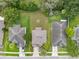 Aerial backyard showing a well-manicured lawn with a fire pit and privacy fencing, great for outdoor activities and relaxation at 13830 Trull Way, Hudson, FL 34669