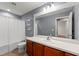 Bathroom features a large mirror, wood cabinets, and shower-tub combination at 13830 Trull Way, Hudson, FL 34669