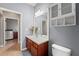 Bathroom with white vanity and cabinet at 13830 Trull Way, Hudson, FL 34669