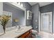 Bathroom with white vanity and storage cabinet at 13830 Trull Way, Hudson, FL 34669