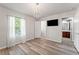 Bedroom featuring a decorative chandelier and a doorway leading to a bathroom at 13830 Trull Way, Hudson, FL 34669