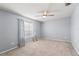 Bedroom featuring neutral carpet, light blue walls, and patterned curtains at 13830 Trull Way, Hudson, FL 34669