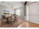 Dining room featuring a wooden table and chairs, area rug, and bright lighting at 13830 Trull Way, Hudson, FL 34669