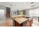 Open kitchen featuring granite countertops, stainless steel appliances, and island sink at 13830 Trull Way, Hudson, FL 34669