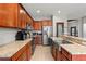 Kitchen with stainless steel appliances, tile floors and granite countertops at 13830 Trull Way, Hudson, FL 34669