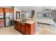 Open kitchen with granite countertops and stainless steel appliances at 13830 Trull Way, Hudson, FL 34669