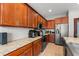 Well-equipped kitchen with granite countertops and stainless steel appliances at 13830 Trull Way, Hudson, FL 34669
