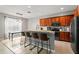 Kitchen featuring granite countertops, stainless steel appliances, breakfast bar and tile floors at 13830 Trull Way, Hudson, FL 34669