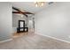 Bright living room featuring decorative ceiling beams and a stylish console table at 13830 Trull Way, Hudson, FL 34669