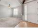 Open living room space with carpet flooring, bright lighting, and neutral-colored walls at 13830 Trull Way, Hudson, FL 34669