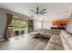 Spacious living room with an open layout and a large sliding door to the patio at 13830 Trull Way, Hudson, FL 34669