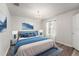 Bedroom featuring a plush bed, a painting, and wood floors at 13830 Trull Way, Hudson, FL 34669