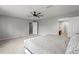 Spacious main bedroom with natural light, ceiling fan, and ensuite bathroom at 13830 Trull Way, Hudson, FL 34669