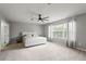 Spacious main bedroom with natural light and a ceiling fan at 13830 Trull Way, Hudson, FL 34669