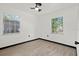 Bright bedroom with natural light, neutral paint, and wood-look flooring, creating a serene and comfortable space at 1512 Hillside Dr, Tampa, FL 33610