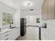 Bright kitchen boasting stainless steel appliances, modern cabinetry, and sleek countertops, perfect for culinary endeavors at 1512 Hillside Dr, Tampa, FL 33610