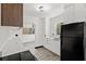 Well-lit kitchen featuring stainless steel appliances, light countertops, and stylish cabinetry, creating a functional space at 1512 Hillside Dr, Tampa, FL 33610