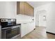 Well-equipped kitchen with modern stainless steel appliances, sleek countertops, and white cabinets, creating a functional design at 1512 Hillside Dr, Tampa, FL 33610