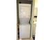 Convenient laundry area with stacked washer and dryer units for efficient space utilization at 1605 Mission Hills Blvd # D5, Clearwater, FL 33759