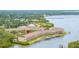 Aerial view of the waterfront condos and boat slips giving residents easy access to boating on the bay at 163 Brent Cir, Oldsmar, FL 34677