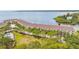 Aerial view of waterfront townhomes with community pool overlooking the water at 163 Brent Cir, Oldsmar, FL 34677