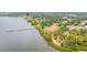 Aerial view showcasing the neighborhood's proximity to the water and local parks with a walking pier at 163 Brent Cir, Oldsmar, FL 34677