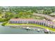 Aerial view of the waterfront condos and tennis courts, offering a variety of recreational opportunities at 163 Brent Cir, Oldsmar, FL 34677