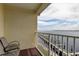 Balcony view with seating overlooking the water and a long wooden pier at 163 Brent Cir, Oldsmar, FL 34677
