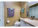 Well-maintained bathroom featuring vanity with sink, toilet, and shower with curtains for comfort at 163 Brent Cir, Oldsmar, FL 34677
