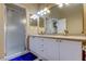 Bright bathroom with double vanity, walk-in shower, and plenty of cabinet storage at 163 Brent Cir, Oldsmar, FL 34677