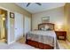 Comfortable bedroom featuring a ceiling fan, two closets, and soft neutral carpeting at 163 Brent Cir, Oldsmar, FL 34677