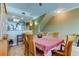 Dining area with seating for six, flowing to the kitchen, and carpet flooring at 163 Brent Cir, Oldsmar, FL 34677